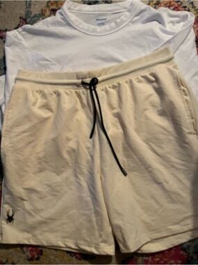 Cream Drawstring Athletic Shorts with Black Spider Logo and White Tee Shirt